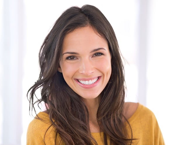 Facelift Surgery A radiant woman with smooth skin and a confident smile, showcasing the rejuvenating effects of a facelift procedure, popular for aesthetic enhancements